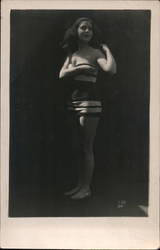 Woman in swimsuit poses Postcard