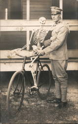Soldier holds skeleton on Bicycle Death Postcard Postcard Postcard