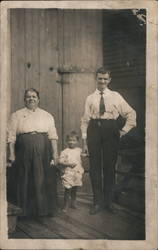 Man, wife and child Postcard