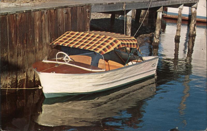 Motor Boat with Plaid Sport Top Next to Pier Copiague New York