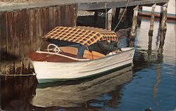 Motor Boat with Plaid Sport Top Next to Pier Postcard
