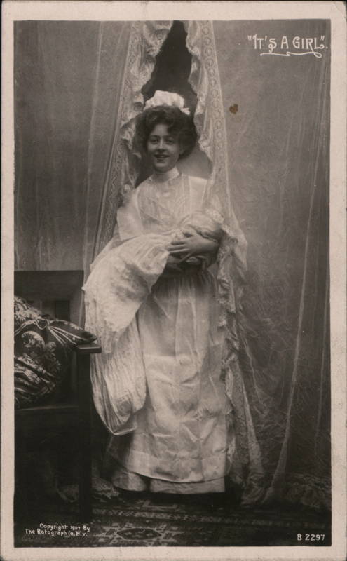 It's a Girl - A Nurse Holding a Baby Babies