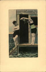 Two ladies in old-fashioned bathing suits post by the sea Postcard