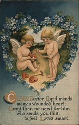 Two cupids mending heart Postcard