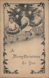 Children With Garland In Front of Tree Postcard