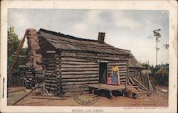 Log Cabin With African American Woman and Child Outside Postcard
