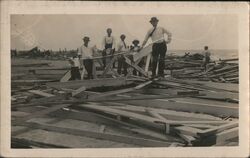 Group of Men & Boys Standing on Debris After Storm Postcard