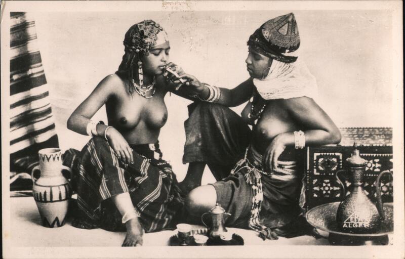 Two Topless Moorish Women Sharing a Drink, Algeria