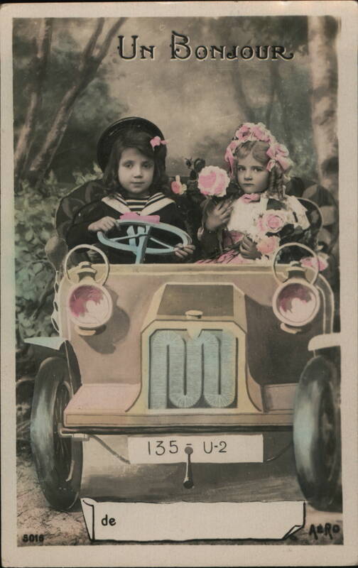Two Children in Antique Toy Car, Un Bonjour