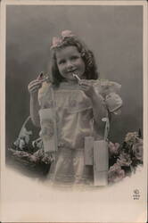 Young Girl with Gifts and Candy Cigarettes Postcard