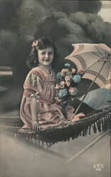 Girl with Flowers and Parasol in Hammock Postcard