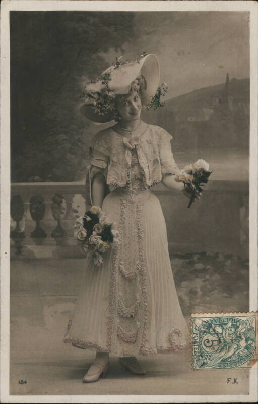 Smiling Woman in Large Hat, Holding Flowers Women