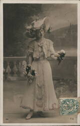Smiling Woman in Large Hat, Holding Flowers Postcard