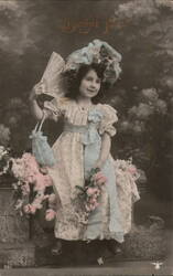 Bonne Fete: Girl with Fan & Flowers, French Holiday Postcard Postcard
