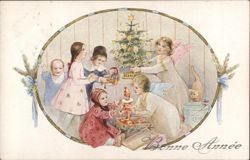 Children and Angels Adorning a Christmas Tree Postcard