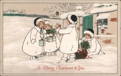 Four Children in White Coats Exchanging Christmas Gifts in the Snow Postcard