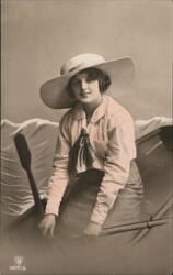 Woman in Pink Blouse and Wide-Brimmed Hat in a Rowboat Postcard