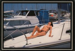 Woman Sunning Topless on a Boat Postcard