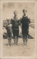 Three Boys in swimwear on a beach Postcard