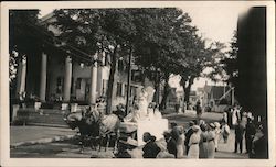 Horse-drawn Float in a Parade American Flag in Background Postcard