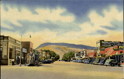 Main Street And Business District Cody, Rattlesnake Mountain In Background Main Street And Business District Cody, Rattlesnake Mountain In Background