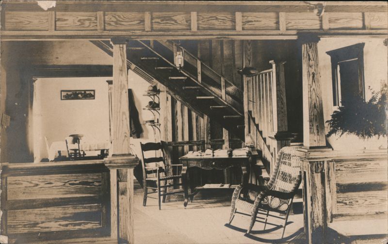 Interior View: Grand Staircase, Desk, Rocking Chair Rapid City Michigan