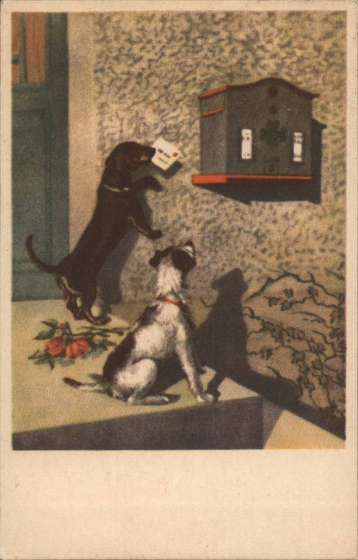 Black dog placing a letter into a mailbox while a black and white dog watches.