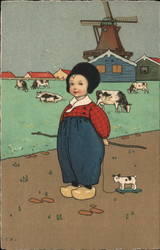 Dutch Child with Toy Standing Before a Field of Cows, Buildings and a Windmill Postcard