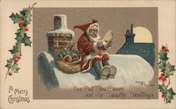 Santa Claus Sitting on Snowy Roof Crossing off List Postcard