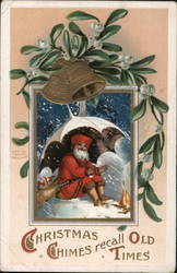 Santa Sitting Under Umbrella in Front of Fire as it Snows Postcard