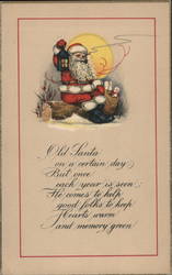 Santa Claus Sitting on Log as He Smokes Pipe Under the Moon Postcard