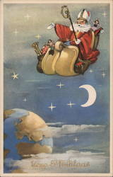 Santa Riding in Sleigh Above Earth Postcard