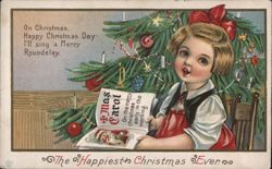 Girl Reading Xmas Carol Book by Christmas Tree Postcard