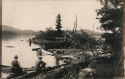 Men Relaxing by Lake Shore Postcard