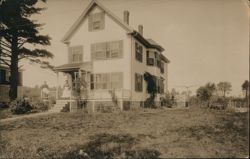 Two Women on Porch of Large Wooden House Postcard