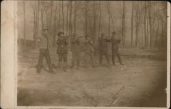 Six Men Posing with Rifles in Forest Clearing Postcard