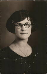 Woman with Bobbed Hair and Round Glasses Postcard