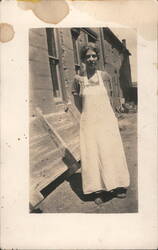 Woman in Apron Standing Outdoors Postcard