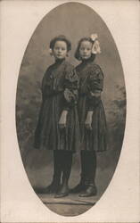 Two Young Girls in Matching Plaid Dresses, Oval Vignette Postcard