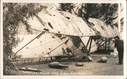 Damaged German WWI Biplane & Aerial Torpedoes Postcard
