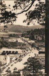 Elkhorn Ave. and Estes Park Village From the West Postcard