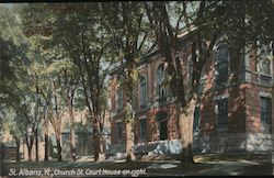 St. Albans, Vt., Church St. Courthouse on right. Postcard