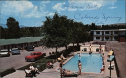 Iowa Motel with Swimming Pool and Classic Cars Postcard