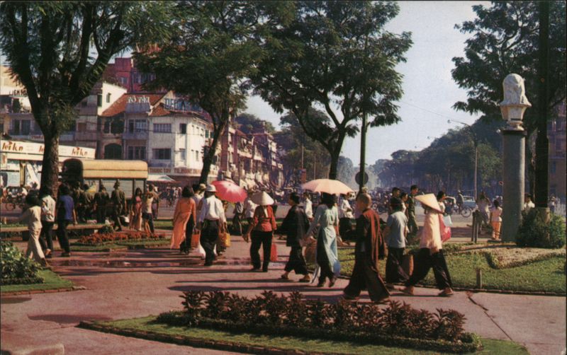 Crowd in downtown Saigon park-circle Vietnam Mike Roberts