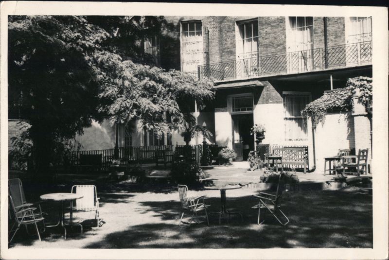 Shaded Garden Courtyard with Building and Balconies