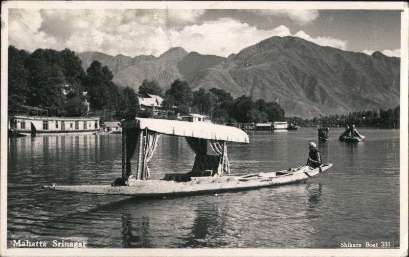 Shikara Boat on Dal Lake with Houseboats, Srinagar India