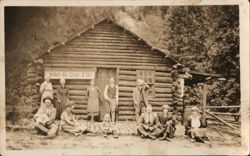 Group Outside Hotel du LION d'Or Log Cabin Postcard