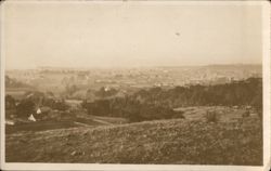 Panoramic View of Town in Valley from Hillside Postcard