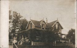 Queen Anne Style House with Vine-Covered Porch Postcard