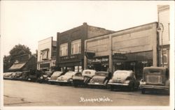 Main Street with Cars and Shops in Banpor, Michigan Postcard